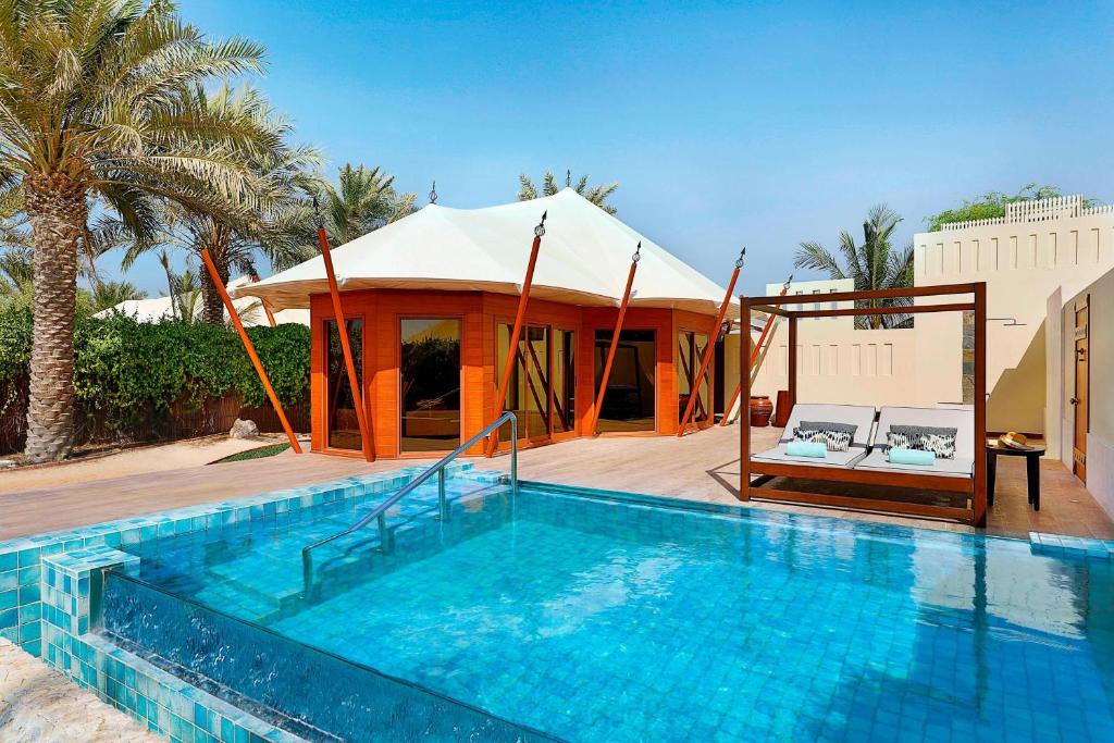 The Ritz-Carlton Ras Al Khaimah Al Hamra Beach photos of tourists