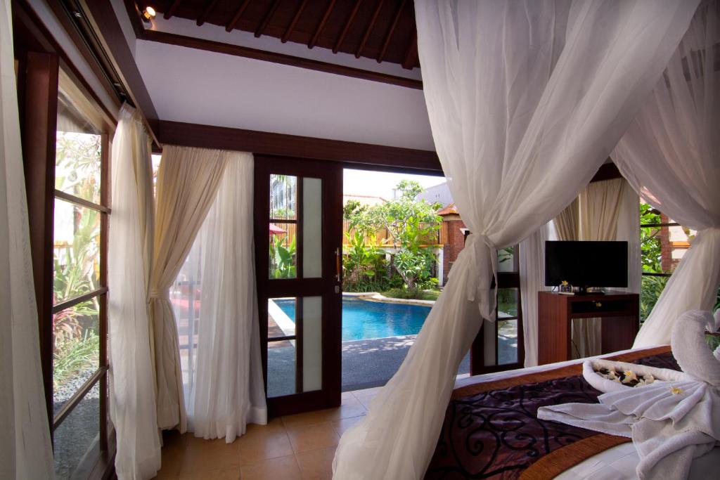 Відпочинок в готелі The Awan Villas Семіньяк Індонезія